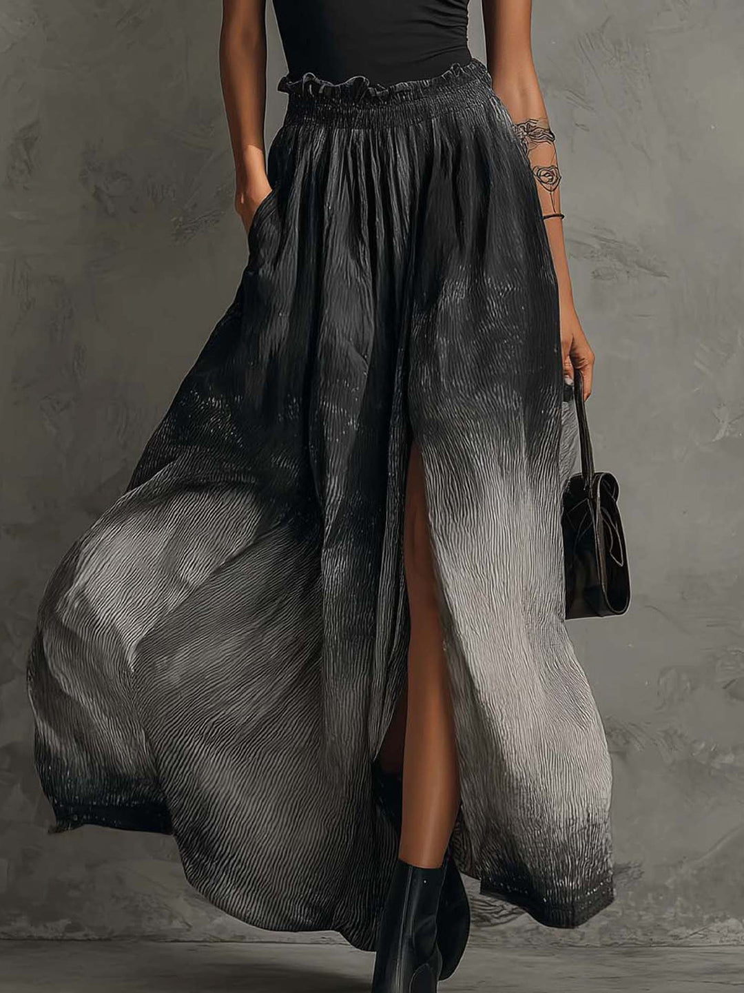 Sort off-shoulder top med flæser og gradient plisseret maxinederdel sæt