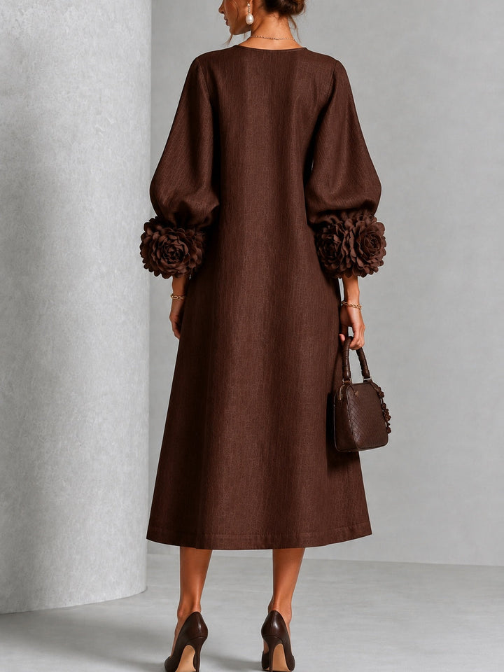 Robe midi fleurie à poignets boutonnés