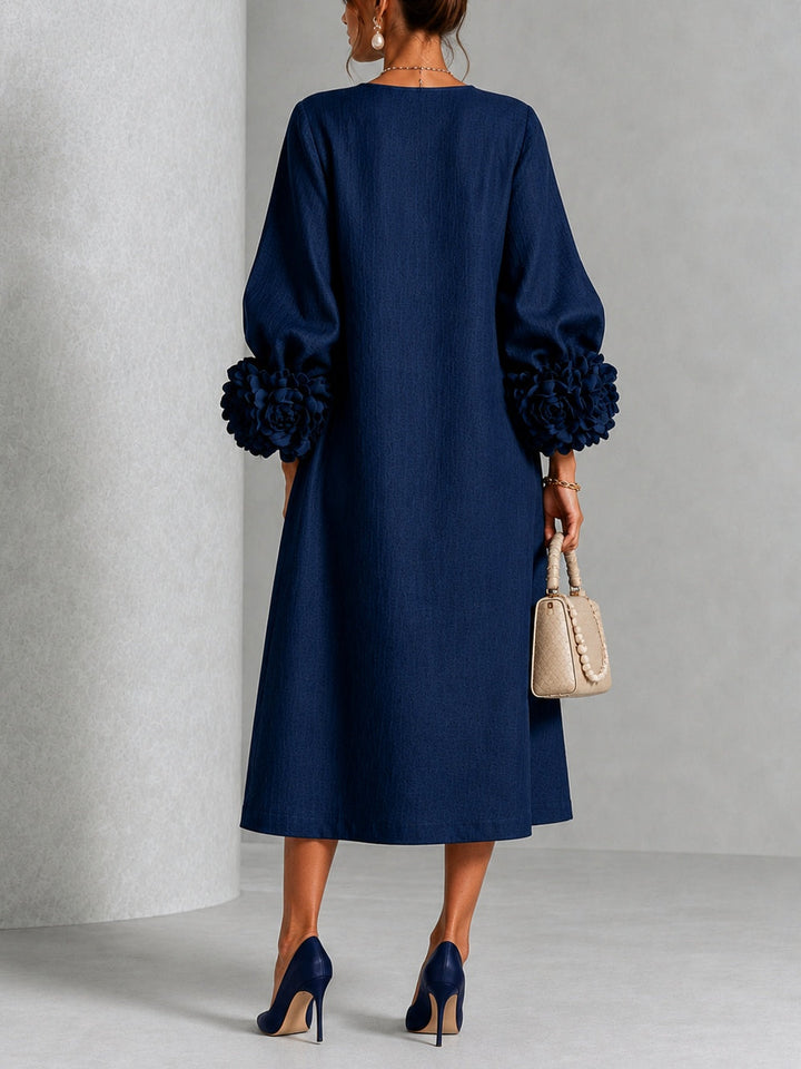Robe midi fleurie à poignets boutonnés